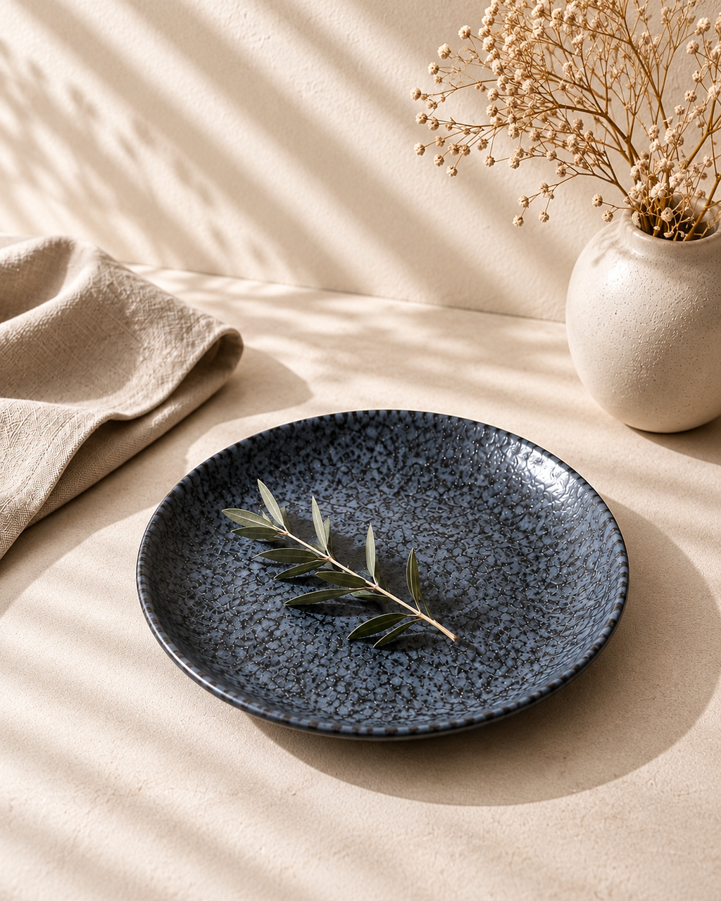 Pietra dark grey stone-textured ceramic plates by NYOUME